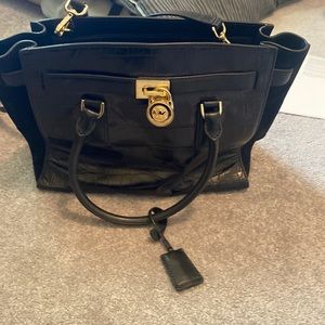 Black Michael Kors snake skin travel back barely used very good condition.
